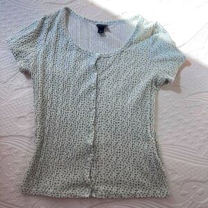White button top with green floral pattern